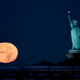 Moon setting near the Statue of Liberty, New York. Image: Julio Cortez/AP